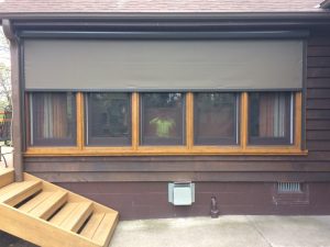 Motorized vertical drop screen